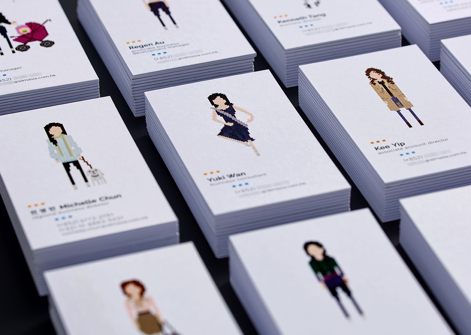 A leading Asian Digital Marketing Agency Brand based in Hong Kong and office in South Korea :: Identity Revamp and New Business Card Design :: business card, name card, 12 decks, dynamic branding, personalisation pixelated figures of every individuals, black table top, anglar view focusing on YW ballet dancing, 4 x 3 arrangement